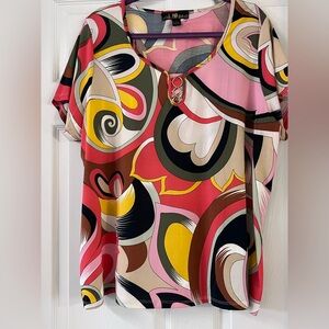 Multi colored woman’s shirt. 2x, brand new, never worn.